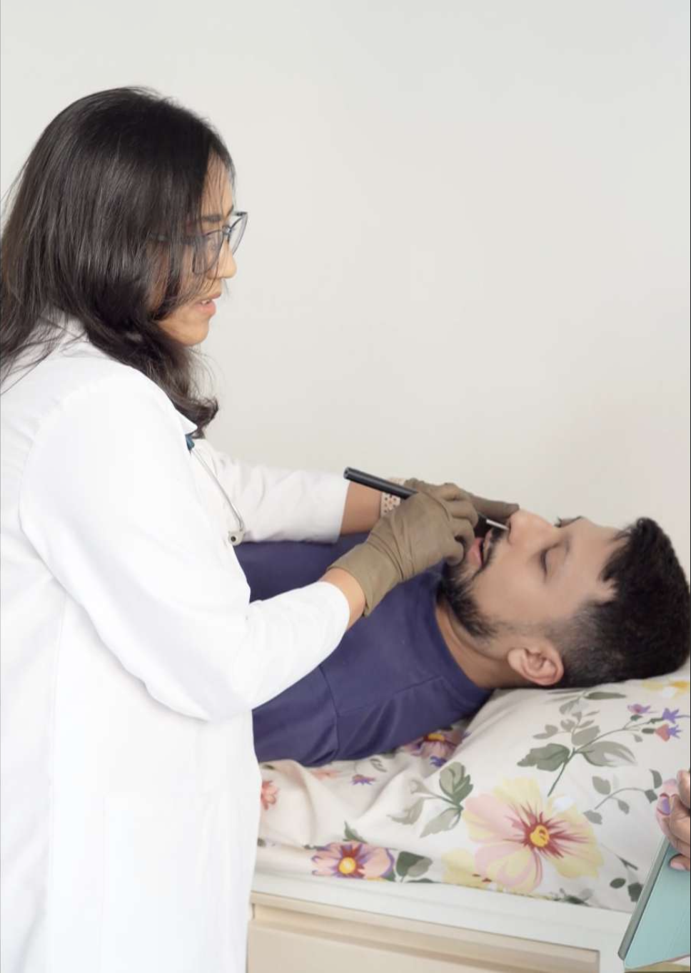 Dr. Maroo examining a patient at the Allergy & Asthma Centre